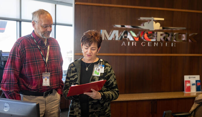 Maverick employees standing at front desk